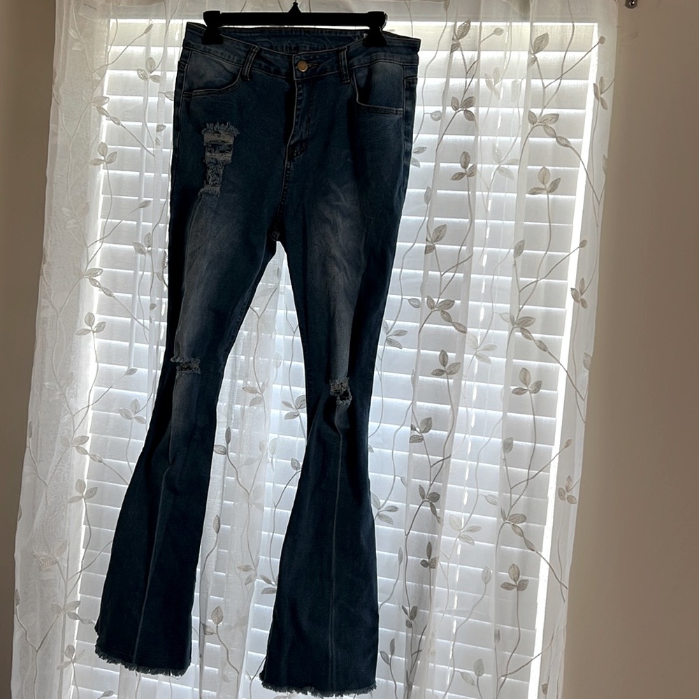 Front & Back light wash denim. Size Large. Never been worn.
